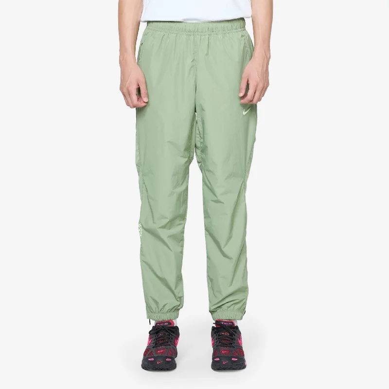 Flared pants NOCTA Woven Track Pant Oil Green | Light Liquid Lime